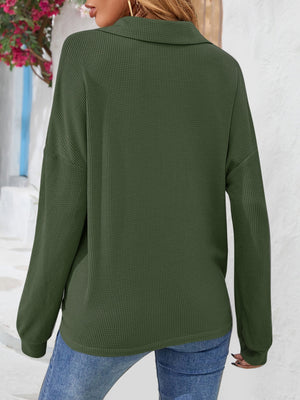Army green waffle knit henley blouse with collar and long sleeves.