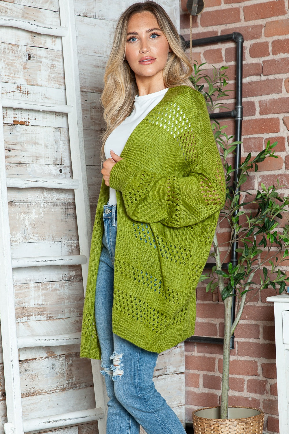 Open-knit slouchy cardigan in Matcha Green with wide sleeves and a relaxed fit.
