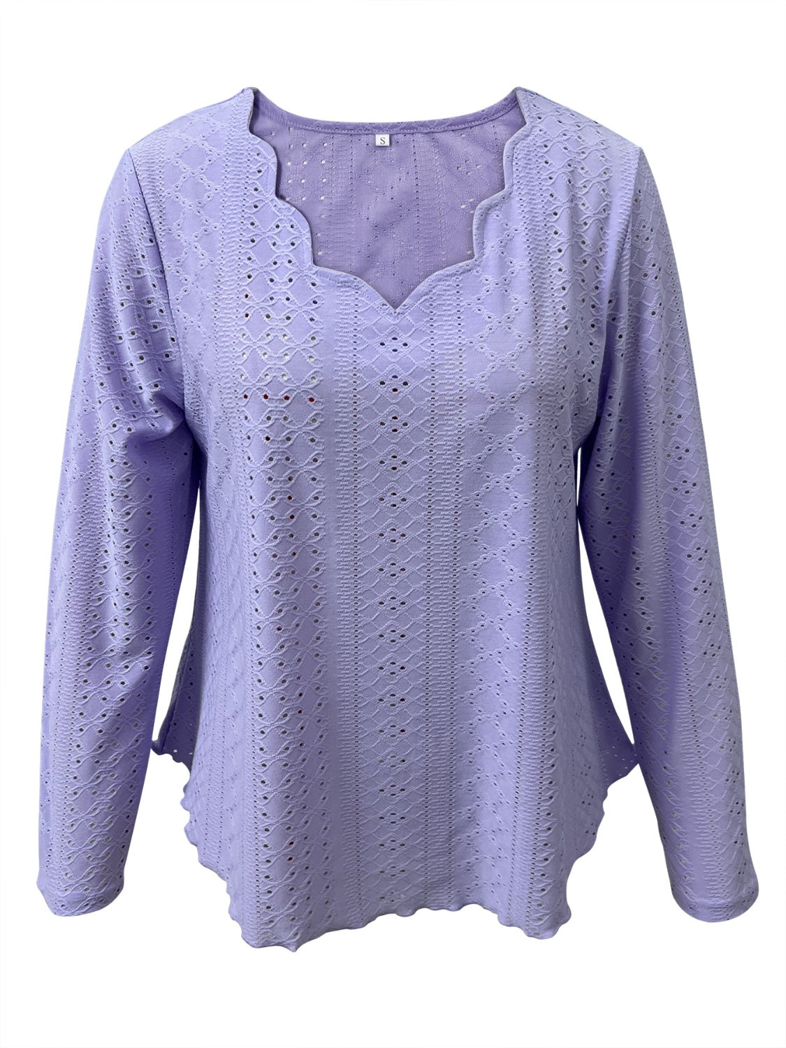 Lavender eyelet blouse with scalloped neckline and long sleeves.