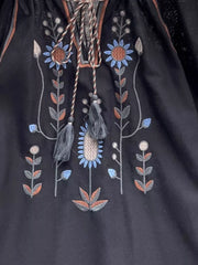 Black embroidered tie neck blouse with floral detail and tassels