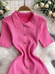 Pink ribbed knit midi dress with collar and gold butterfly button detail.