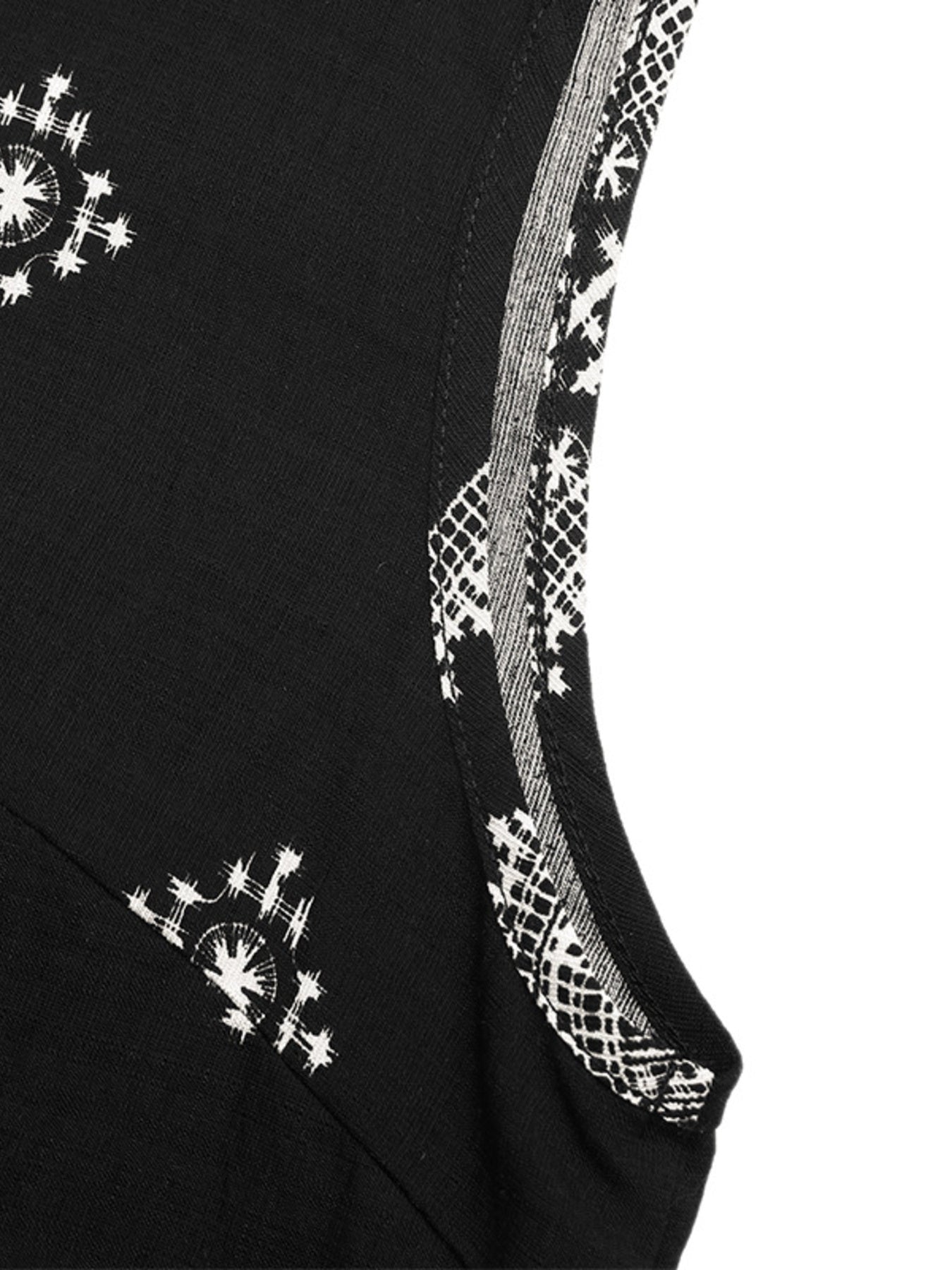 Black sleeveless top with white geometric print and contrast trim detail.