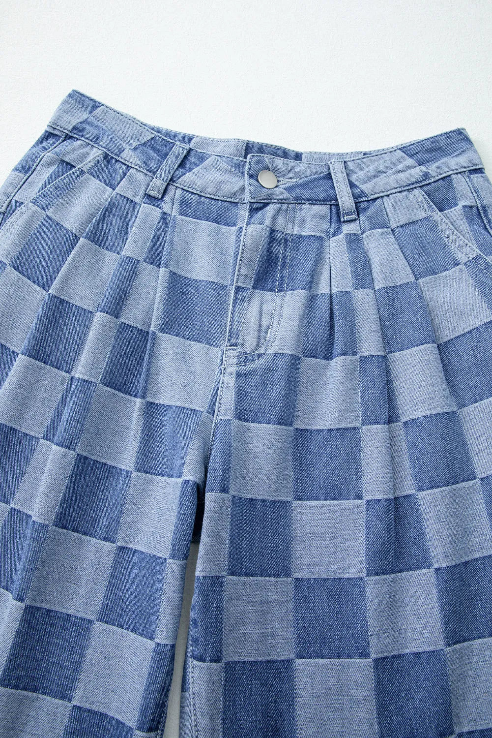Checkerboard denim wide leg trousers in dusty blue with pleated front detail.