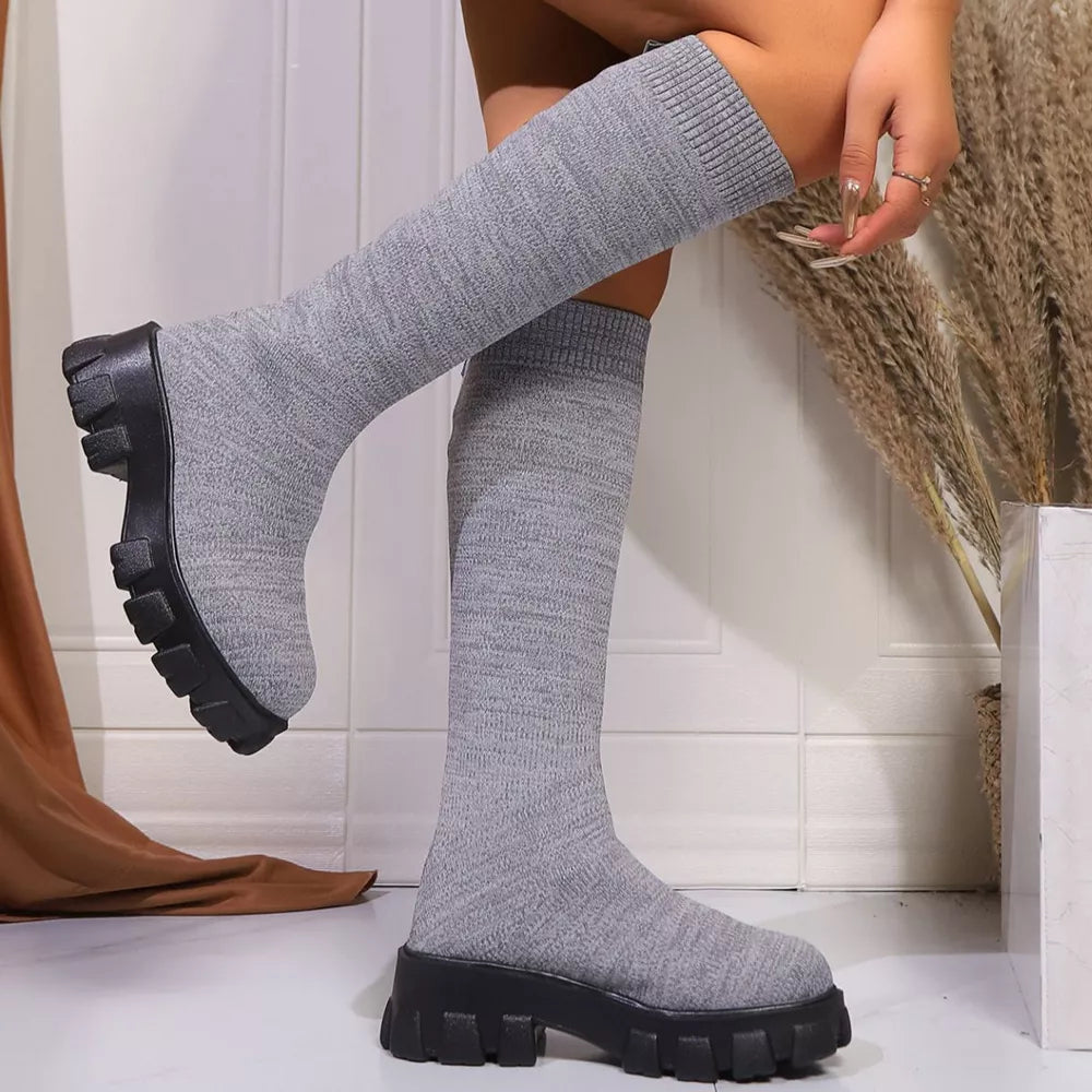 Gray knit knee-high boots with chunky platform soles