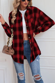 Red plaid drop-shoulder jacket with button front and chest pocket, styled with jeans.