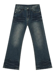 Faded wash flare jeans in dark denim with a bootcut leg and distressed details.