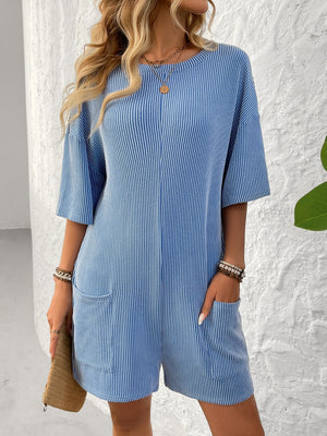 Sky blue ribbed knit romper with white pinstripes and front pockets.
