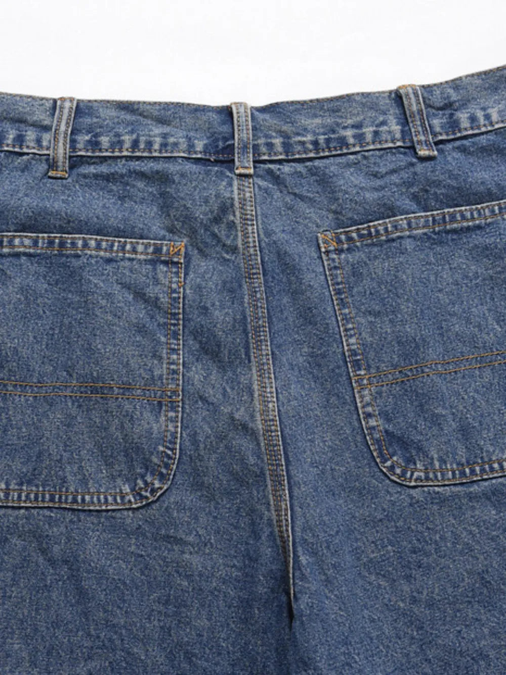 Carpenter denim bermuda shorts in medium wash with double-stitched back pockets.