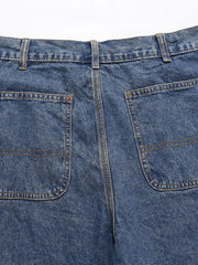 Carpenter denim bermuda shorts in medium wash with double-stitched back pockets.