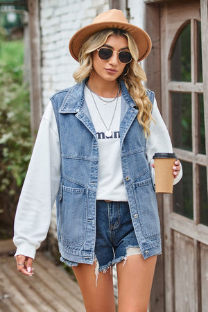 Denim vest with button front and chest pockets, styled with a white sweatshirt and denim shorts.