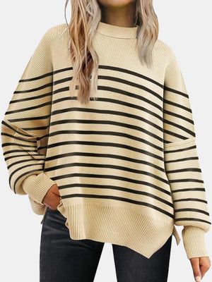 Striped knit sweater with slouchy sleeves and ribbed details in beige and black.