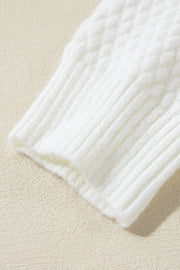 White knit sweater with cable knit detail and ribbed cuffs