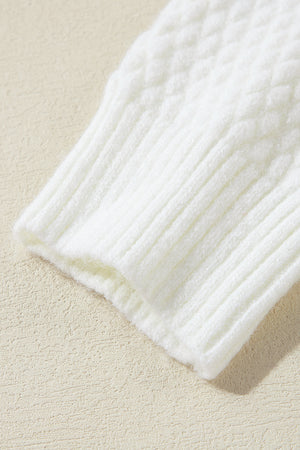 White knit sweater with cable knit detail and ribbed cuffs