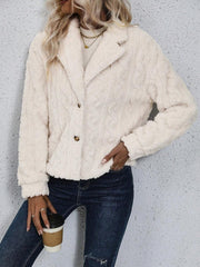 Cream textured teddy bear blazer with button closure and notched lapel.