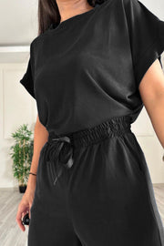 Black relaxed fit tee and wide leg pants set with drawstring waist