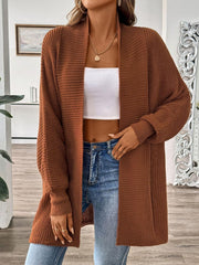 Brown ribbed knit cocoon cardigan with open front and long sleeves.
