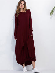 Burgundy balloon hem maxi dress with long sleeves and round neckline.