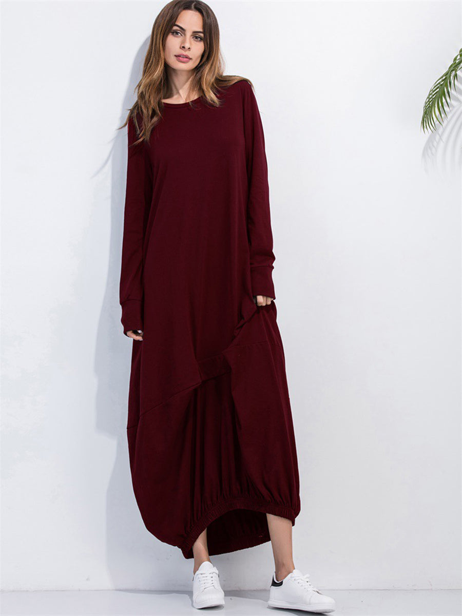 Burgundy balloon hem maxi dress with long sleeves and round neckline.