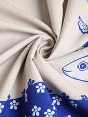 Spaghetti strap midi dress in cream with blue sardine and floral print border.