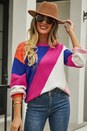 Geometric colorblock knit crewneck sweater in hot pink, blue, white, and orange acrylic blend.