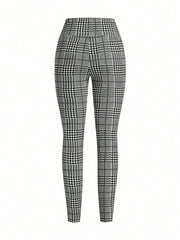 Plaid high waist slim fit ankle length trousers in black and white.