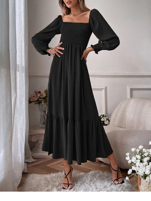 Black smocked midi dress with puff sleeves, square neckline, and tiered ruffle hem.