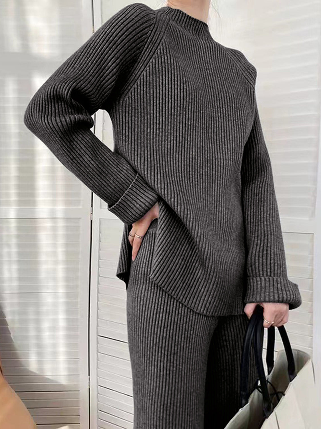 Dark Gray ribbed knit co-ord set with asymmetric hem and mock neck.