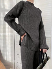 Dark Gray ribbed knit co-ord set with asymmetric hem and mock neck.