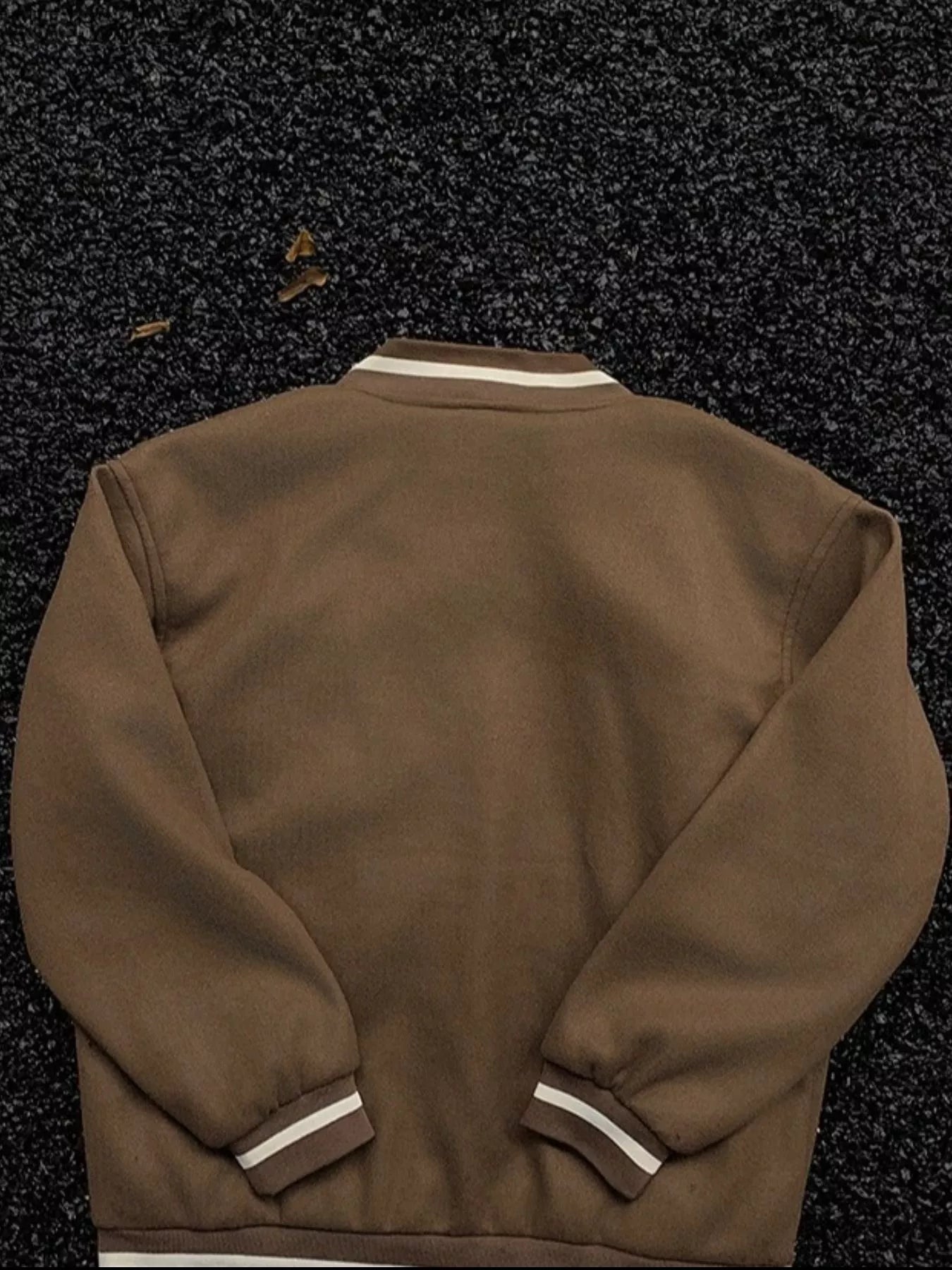 Plus-size coffee brown bomber jacket with white striped collar and cuffs.