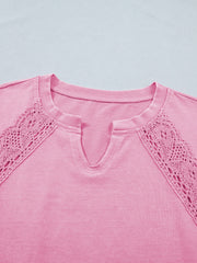 Pink mineral wash cotton tee with notched neckline and crochet lace detail.