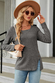 Dark Gray asymmetric top with square neck, button detail on side slit, and long sleeves.