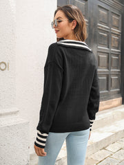 Black acrylic knit pullover sweater with striped trim V-neck and cuffs.