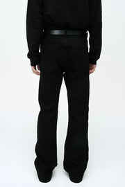 Flared leg black denim jeans with a classic five-pocket design and belt loops.