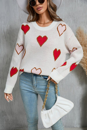 White knit crewneck sweater with red and blush pink heart motif, crew neck, long sleeves