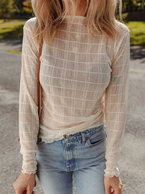 Sheer beige long-sleeve top with a plaid pattern and lettuce trim cuffs.