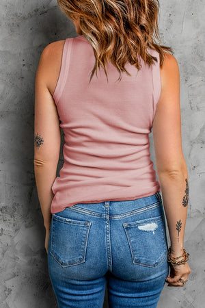 Ribbed knit tank top in dusty pink with scoop neck and racerback detail.