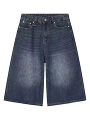 Dark wash wide-leg denim culotte shorts with a vintage feel.