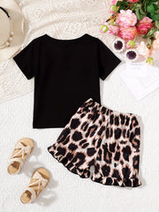Baby girl black tee with bow accent and leopard print shorts set with ruffled hem.