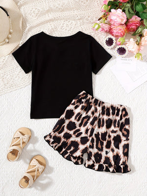 Baby girl black tee with bow accent and leopard print shorts set with ruffled hem.