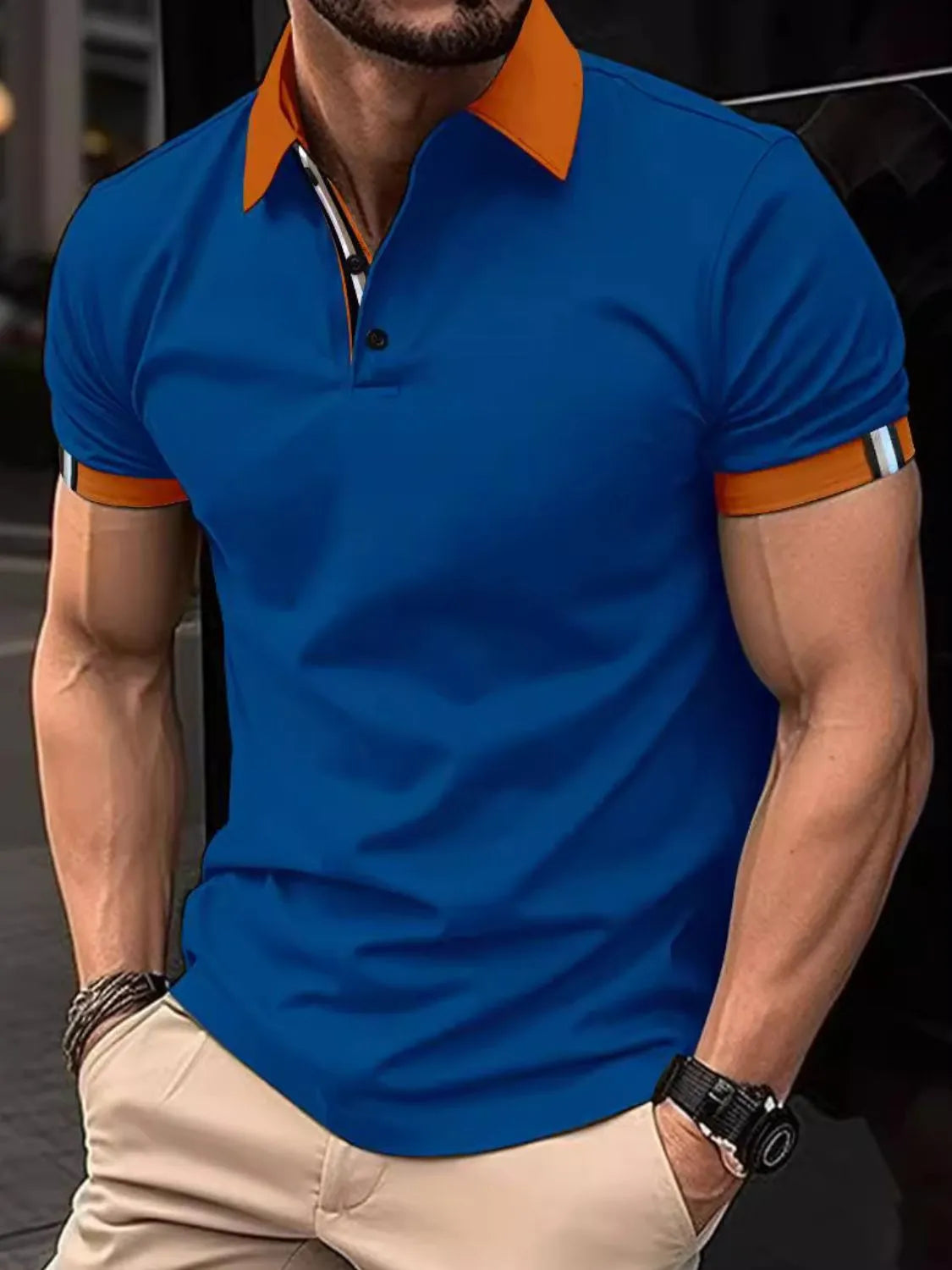 Royal blue polo shirt with contrast orange collar and striped sleeve trim