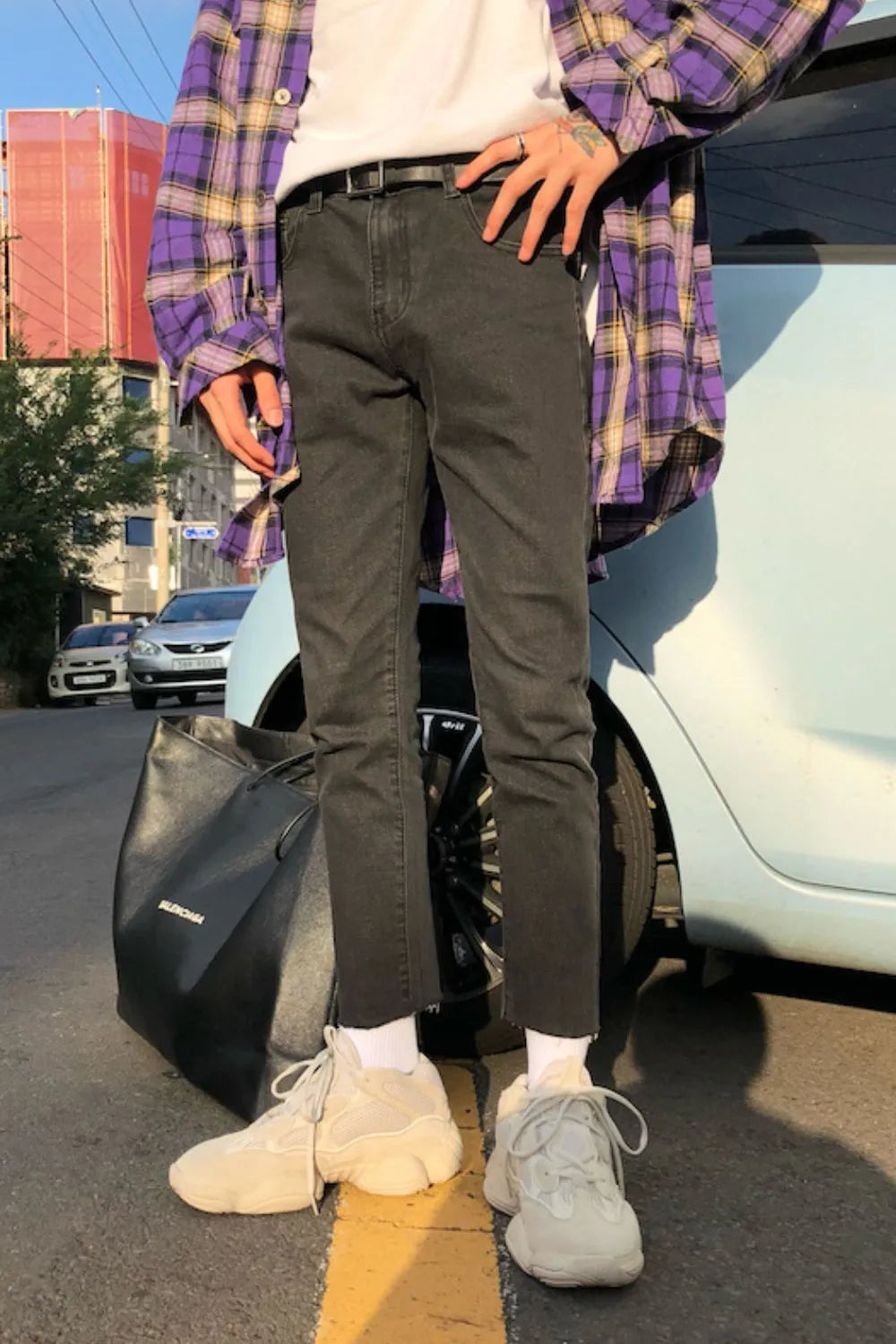 Dark washed denim slim-fit trousers with raw hem detail