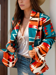 Southwestern print shawl collar jacket in peacock blue with bold geometric patterns.