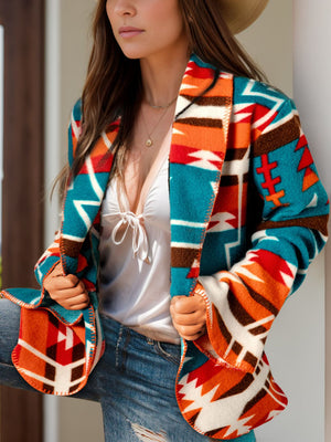 Southwestern print shawl collar jacket in peacock blue with bold geometric patterns.