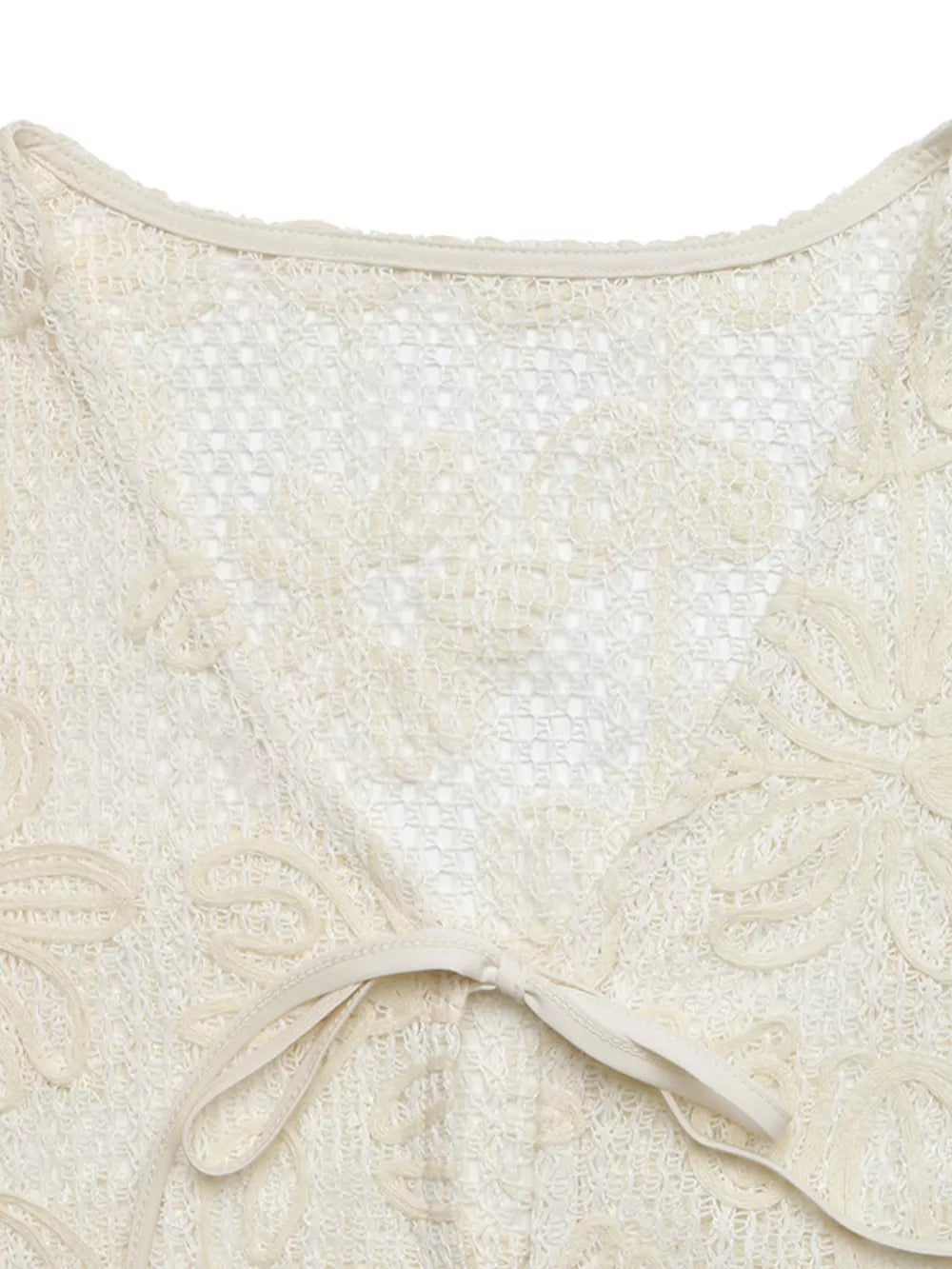Apricot lace tie-front undershirt with floral cutouts and a V-neck.