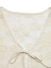 Apricot lace tie-front undershirt with floral cutouts and a V-neck.