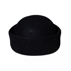 Black wool pillbox hat with a rounded crown and flat brim.