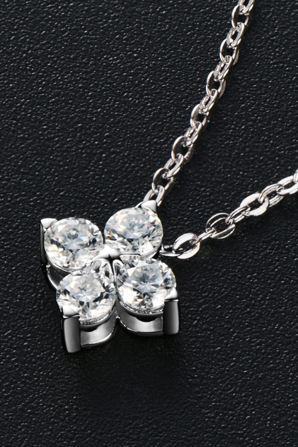 Four-petal diamond blossom necklace in silver sterling silver with clear cubic zirconia.