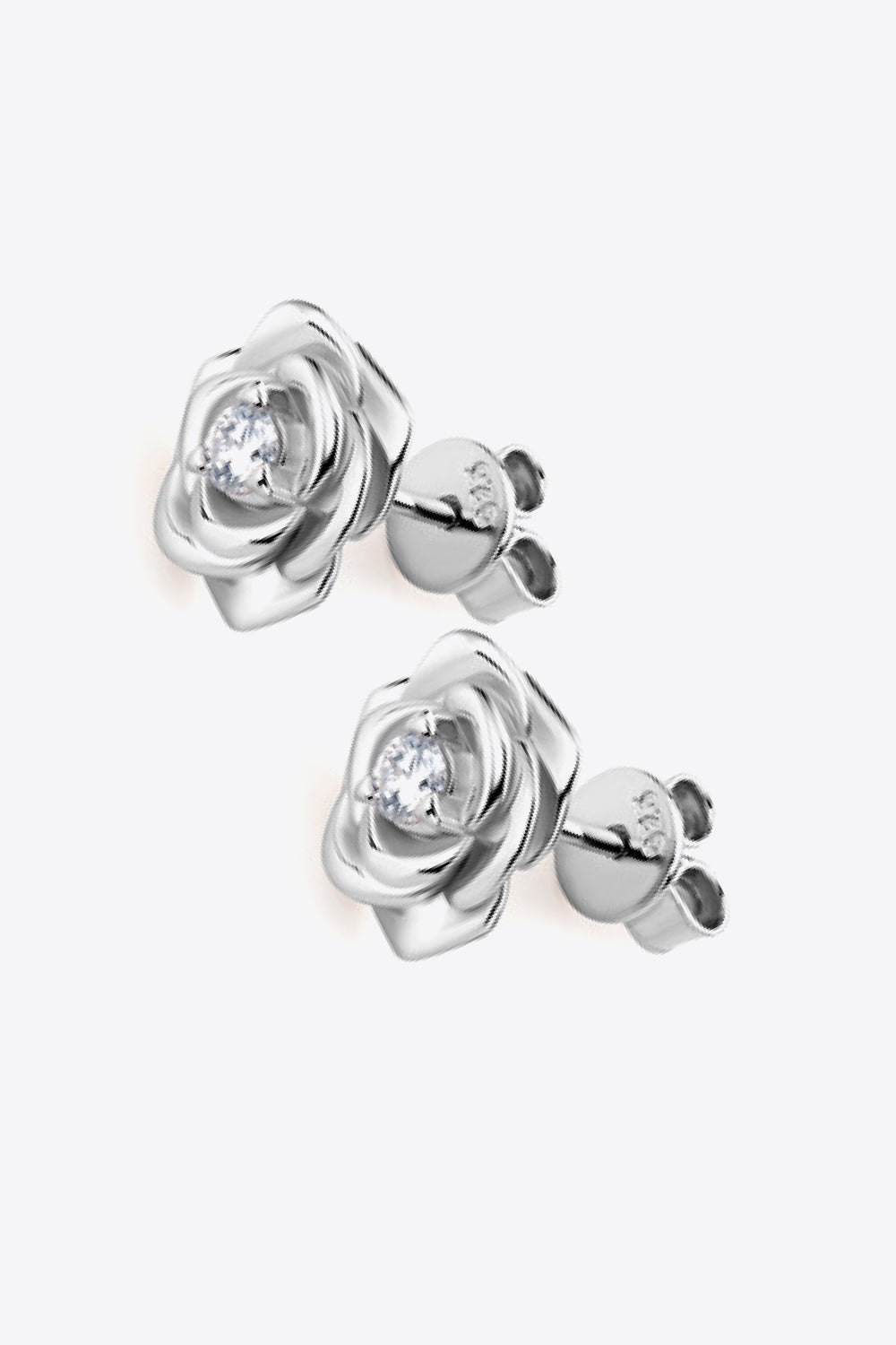 Silver rose stud earrings with a diamond center detail.