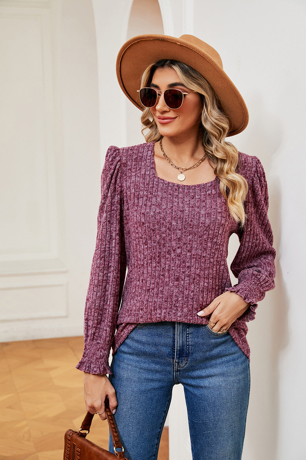 Textured square neck blouse with puff sleeves and ruffled cuffs in a deep rose color.
