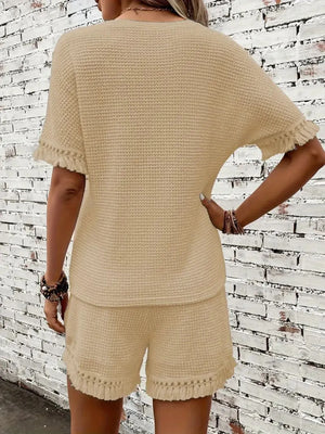 Tan textured knit set with fringe detail on short sleeves and hem.